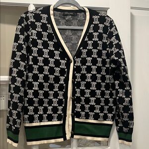 Elegant Black and White Cardigan with Green Trim